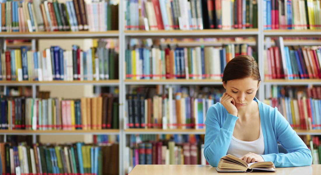 Student in the library reading slow