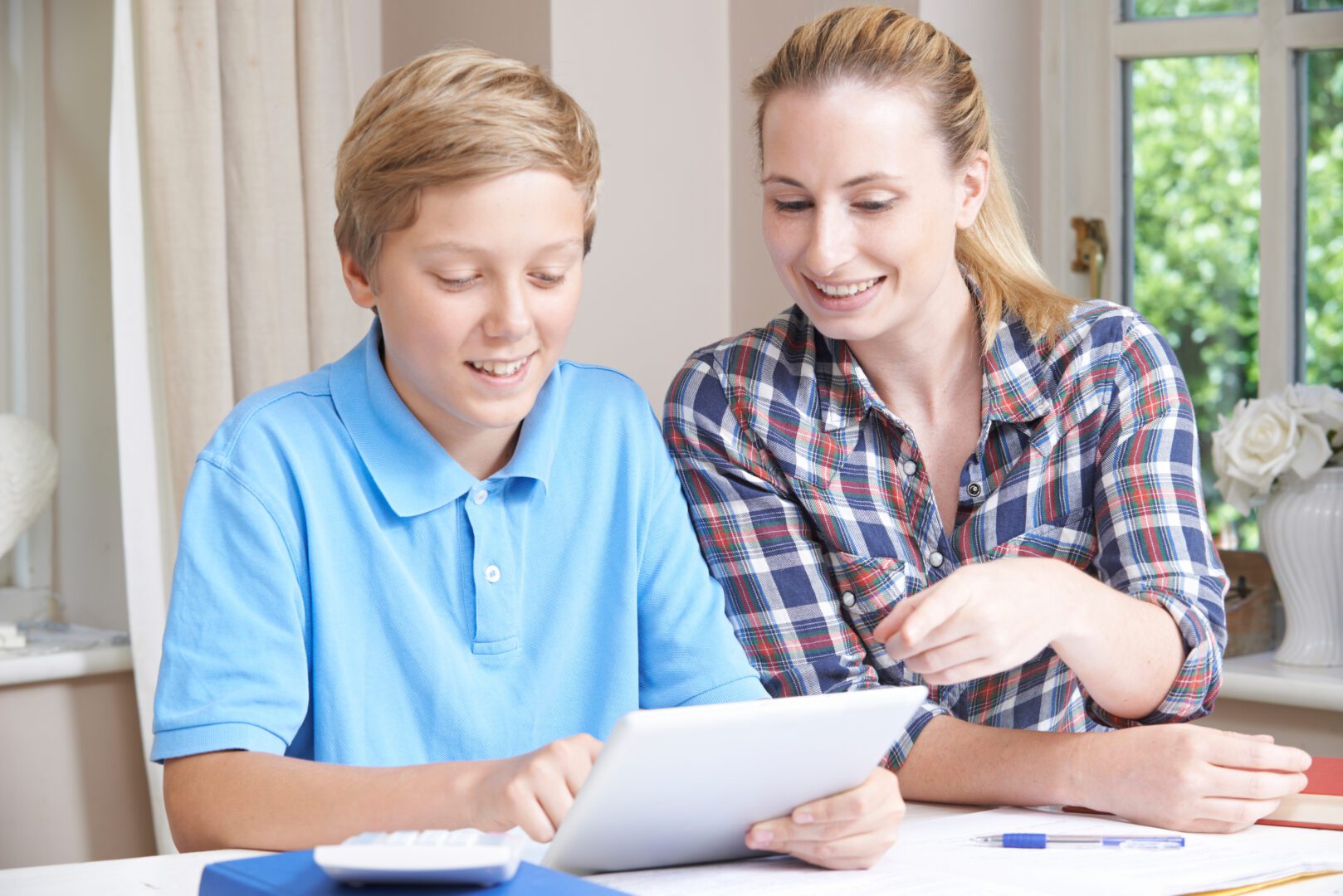 Mother Helping Son With Studying
