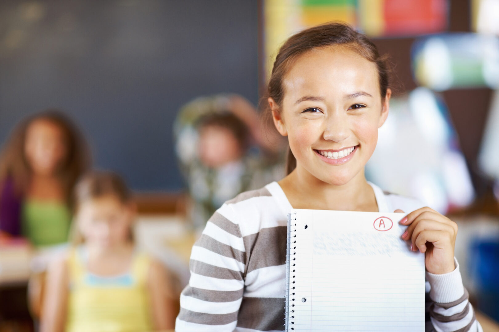 Student holding report card